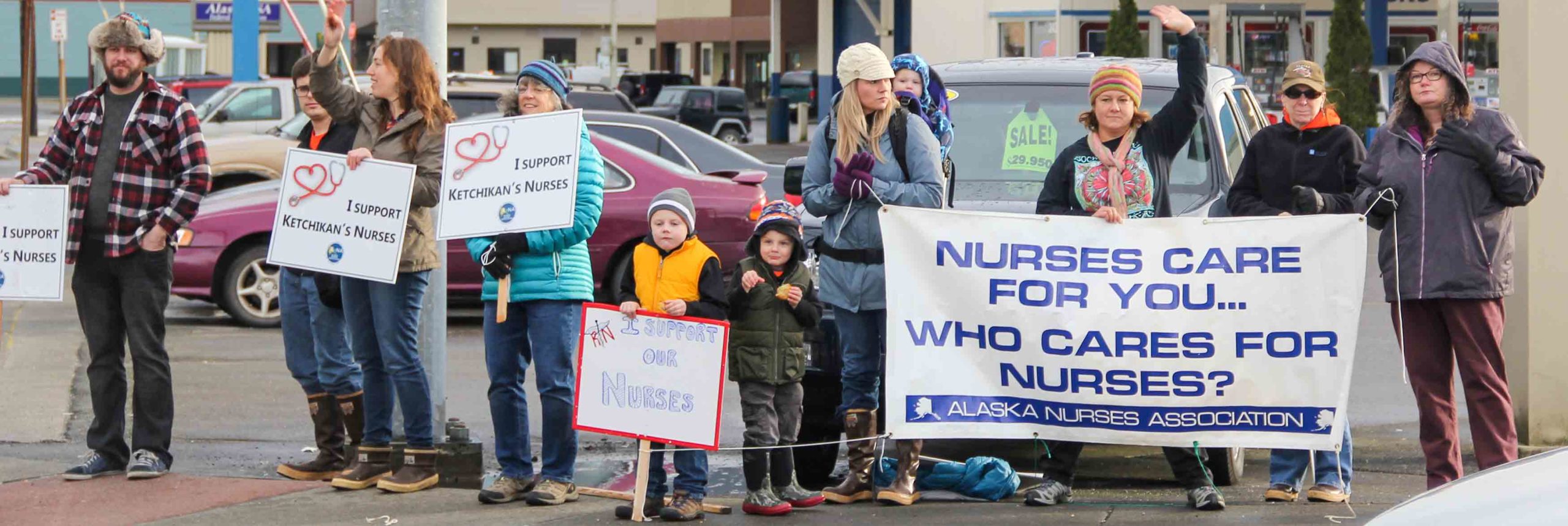 supporting nurses with written banners and signs